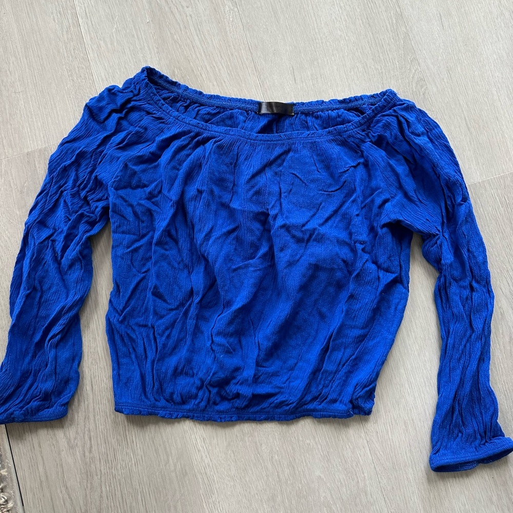 Vibrant blue off the shoulder crop top -‎ flowy and cinched around the stomach